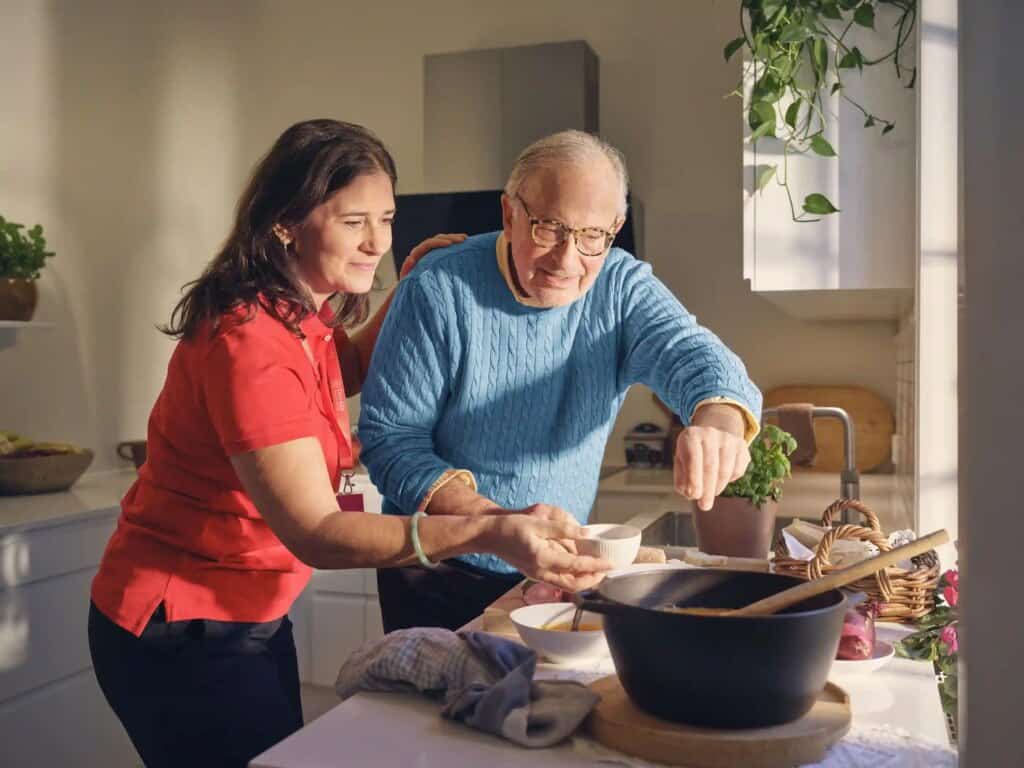 Caregiver helping with light household tasks