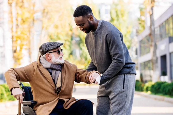 Caregiver assisting with medication management