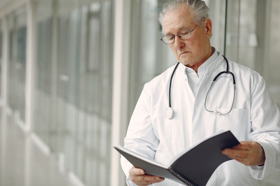 Caregiver reviewing medication schedule with senior
